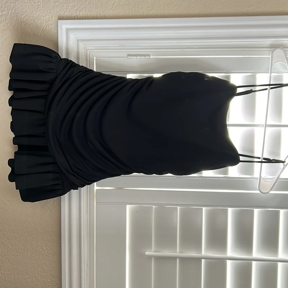 A black dress with cute ruffles and shape to the body - Picture 2 of 4